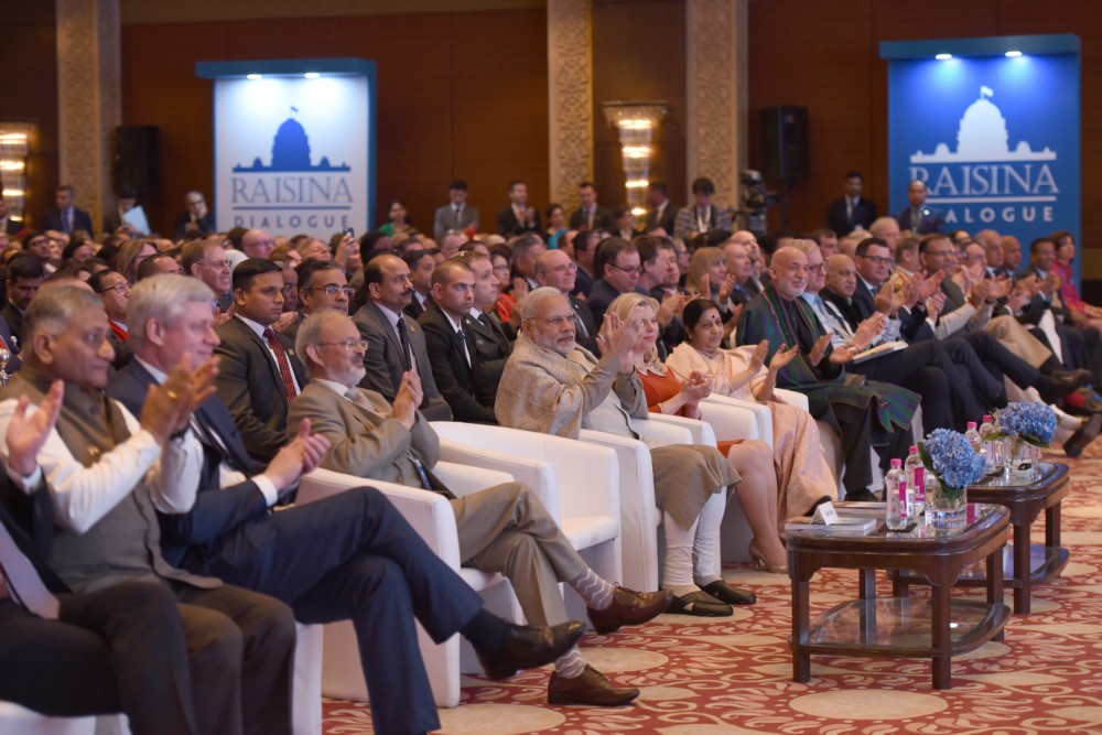 A group of dignitaries including India's Prime minister Modi sitting in an auditorium clapping during the Raisina Dialogue in New Delhi, January 2018.